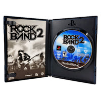 Rock Band 2 PlayStation 2 Very Good - Open Case Displaying Game Contents
