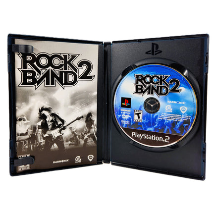 Rock Band 2 PlayStation 2 Very Good - Open Case Displaying Game Contents