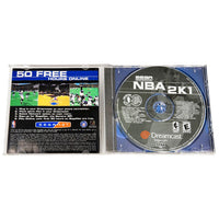 Sega Dreamcast NBA 2K1 game disc and manual on a white background