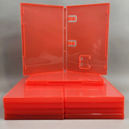 Nintendo Switch 2 Replacement Game Case 10-Pack - Empty Cartridge Case [Red] - View of one case sitting on a stack of cases opened up to show instruction manual clips and cartridge holder, new condition