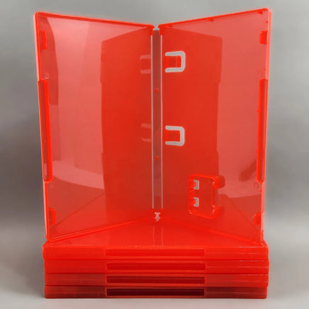 Nintendo Switch 2 Replacement Game Case 5-Pack - Alternate view of 5 empty Cartridge Cases [Red] - View of an open case showing manual clips and cartridge holder sitting on top of a stack of 4 more closed cases, new condition