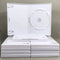 Nintendo Wii Replacement Game Case 10-Pack - Empty Disc Cases [White] - View of stack of ten games with one on top of the stack showing the iInterior view of a case showing the manual clips on the left and the disc tray on the right, new condition