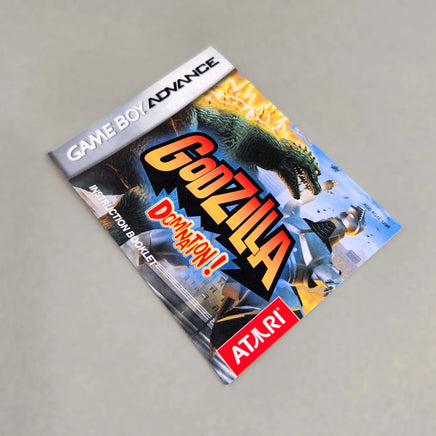 Godzilla Domination! for Game Boy Advance - Front view of the official game instruction manual showing Godzilla artwork and game logo, very good condition