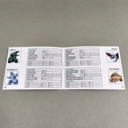 Godzilla Domination! for Game Boy Advance - View of the instruction manual opened to the center pages displaying that the staple binding is intact, very good condition