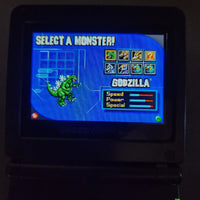 Godzilla Domination! for Game Boy Advance - View of the game shown working on a GBA system with the screen showing the character select screen, very good condition