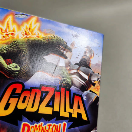 Godzilla Domination! for Game Boy Advance - Close up view of front blemish on game box, very good condition