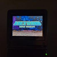 A Nintendo Game Boy Advance displaying the 'Metroid Zero Mission' game screen, set against a very dark, nearly black background.