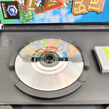 Animal Crossing + Memory Card [Player's Choice] Nintendo GameCube - Open case with close up view of scratch free game disc surface, very good condition