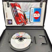 Auto Modellista Nintendo GameCube Very Good CIB - Open case with close up view of scratch free game disc surface, very good condition