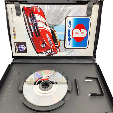 Auto Modellista Nintendo GameCube Very Good CIB - Open case with close up view of scratch free game disc surface, very good condition
