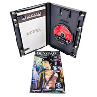 Nintendo GameCube game case for Beyond Good and Evil, shown open with the game disc inside and the front cover booklet placed in front on a white background.