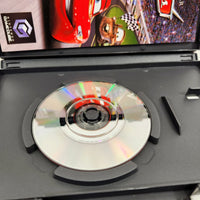 Cars (Disney/Pixar) - Nintendo GameCube - Open case with close up view of scratch free game disc surface, very good condition