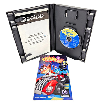 Crash: Tag Team Racing - Nintendo GameCube - Open case showing game disc in tray with instruction manual front shown