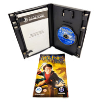 Harry Potter And The Chamber Of Secrets Nintendo GameCube Like New CIB - Close up view of instruction manual in front of open game case with disc