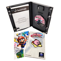 Nintendo GameCube Kirby Air Ride game case opened to show the insert card and game disc, with the game's instruction booklet placed in front on a white background.