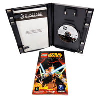 Nintendo GameCube LEGO Star Wars The Video Game package shown open with the black plastic case, game disc, instruction booklet, and front cover on a white background.