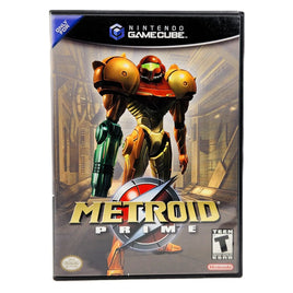 Nintendo GameCube Metroid Prime game case featuring Samus in a gold and red suit with green arm armor, shown on a plain white background.