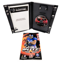 Nintendo GameCube NFL Blitz 2003 video game package shown open with the black GameCube case, game disc, instruction booklet front cover on a white background.