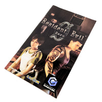 Resident Evil Zero instruction manual by Capcom, featuring character artwork of Claire Redfield and Michael Deast on the cover, photographed on a white background.