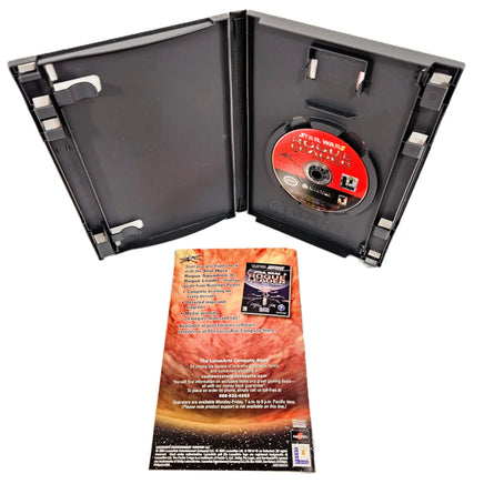 Star Wars Rogue Leader video game package shown open with the game disc inside a black plastic case, plus the instruction booklet, showing the rear artwork, in front on a white background.