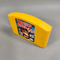 Donkey Kong 64 for Nintendo 64 - N64 cartridge angled to display right shell profile and front label, good condition, loose