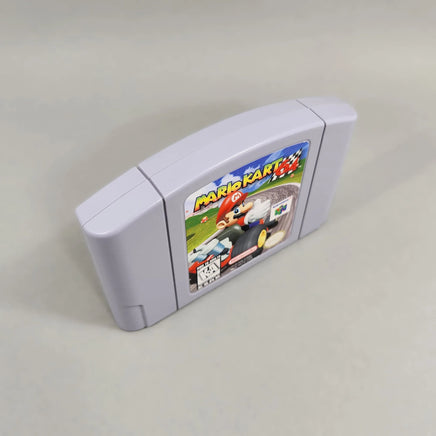Mario Kart 64 for Nintendo 64 - Angled left-front view of authentic N64 cartridge showing label artwork, very good condition, loose