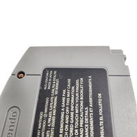 Close-up of the back of a gray Nintendo game cartridge with a black label showing printed text and warning information.
