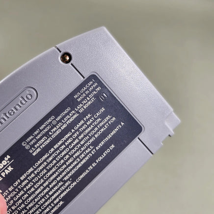 Star Wars Episode I Racer for Nintendo 64 - Close-up of N64 rear caution label and stamped identification number, very good condition, loose