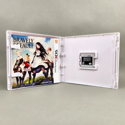 Bravely Default for Nintendo 3DS - Open game case showing cartridge and manual (CIB), very good condition