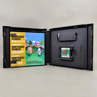Animal Crossing: Wild World for Nintendo DS - Interior case view with artwork and cartridge, good condition