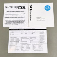Nintendo DS Health and Safety Precautions Booklet and Nintendo Wi-Fi Connection Instruction Booklet & Front Mission game registration card laid out on a gray surface, with the front and back of the booklets visible.