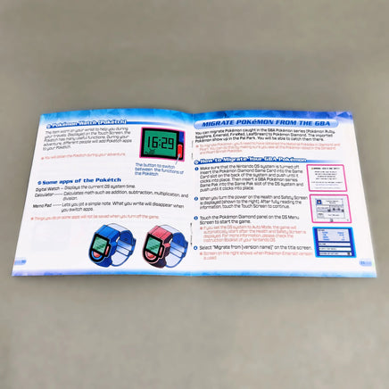 Pokémon Diamond Version for Nintendo DS - View of open instruction manual showing intact staple binding on center pages