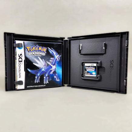 Pokémon Diamond Version for Nintendo DS - CIB contents inside case displaying instruction manual and DS game cartridge, like new condition