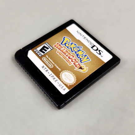 Pokémon HeartGold Version for Nintendo DS - View of game cartridge front shown at an angle, good condition, loose