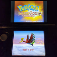 Nintendo Game Freak Pokémon HeartGold Version NDS handheld game console with two screens showing the game's logo and a character flying scene.