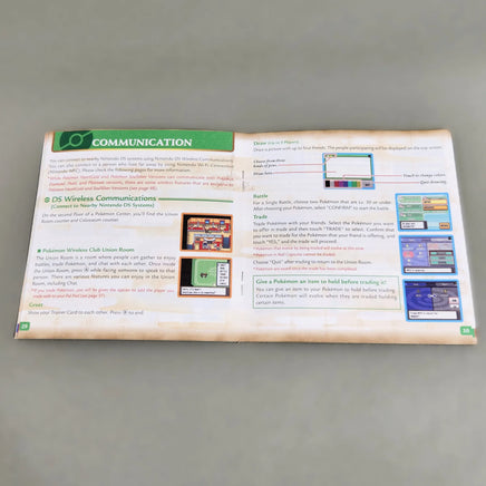 Pokémon HeartGold Version [NFR] Nintendo DS - View of open instruction manual showing center pages and staple binding intact