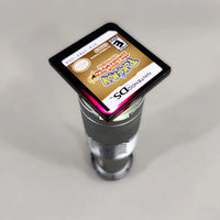 Pokémon HeartGold Version for Nintendo DS - Pokémon DS game cartridge light test showing the characteristic crimson translucent appearance, very good condition, loose