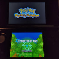 Nintendo 3DS handheld game console displaying the Pokémon Mystery Dungeon: Explorers of Time, with the Pokémon logo on the upper screen and the game's 'Explorers of Time' level selection screen on the lower screen.