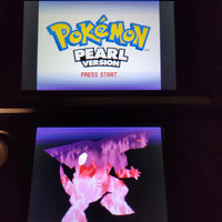 A Nintendo DS game screen showing the Pokémon Pearl Version game main menu above a game display showing a pink and purple Pokémon character.