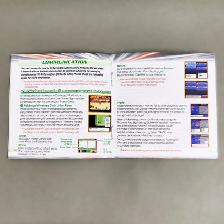 Pokémon Platinum Version for Nintendo DS - Open instruction manual showing center pages and intact staple binding