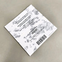 Rear view of Nintendo DS game instruction manual for Pokémon Platinum Version, photographed on a neutral gray surface.