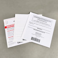 Rear view of a set of Nintendo Club Nintendo promotional inserts and a white Nintendo DS manual on a neutral gray background.