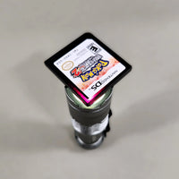 Pokémon White Version 2 for Nintendo DS - Nintendo DS IR cartridge held against a light source to show its reddish-purple translucent shell, very good condition, loose