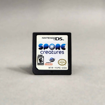 Spore Creatures for Nintendo DS - Game cartridge front label close up view, very good condition, loose