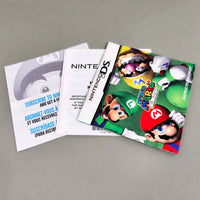 Super Mario 64 DS for Nintendo DS - Authentic instruction booklet front cover shown fanned out with other included pamphlets, like new condition