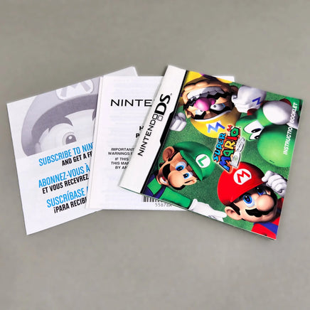 Super Mario 64 DS for Nintendo DS - Authentic instruction booklet front cover shown fanned out with other included pamphlets, like new condition