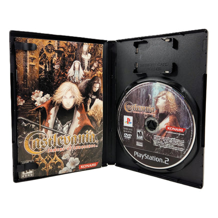 Castlevania Lament of Innocence for PlayStation 2 - Open case view of official game release showing manual and game disc neatly arranged