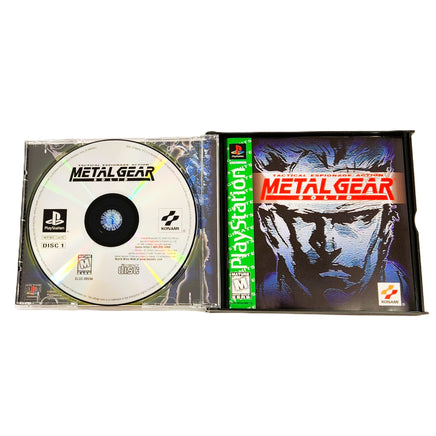 Metal Gear Solid Greatest Hits PlayStation 1 Good CIB - Open Case Displaying Game Disc 1 and Manual