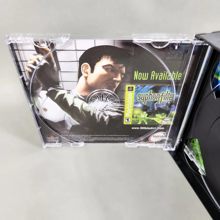 Syphon Filter 2 for PlayStation 1 - Game case interior view 1 with disc removed and artwork visible, like new condition