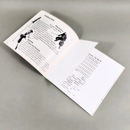 Tenchu: Stealth Assassins for PlayStation 1 - Interior view of open instruction manual at center pages, very good condition